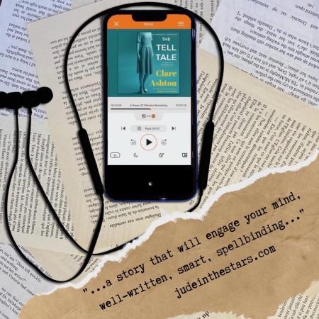 On a backdrop of book pages, an iPhone playing The Tell Tale by Clare Ashton, narrated by Lucy Rayner. At the bottom of the image, a strip of torn paper with a quote: "…a story that will engage your mind, well-written, smart, spellbinding…" and a url: judeinthestars.com