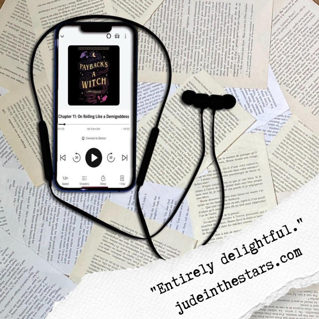 On a backdrop of book pages, an iPhone with the cover of the audiobook of Payback's a Witch by Lana Harper, narrated by Jeremy Carlisle Parker. At the bottom of the image, a strip of torn paper with a quote: "Entirely delightful." and a url: judeinthestars.com.