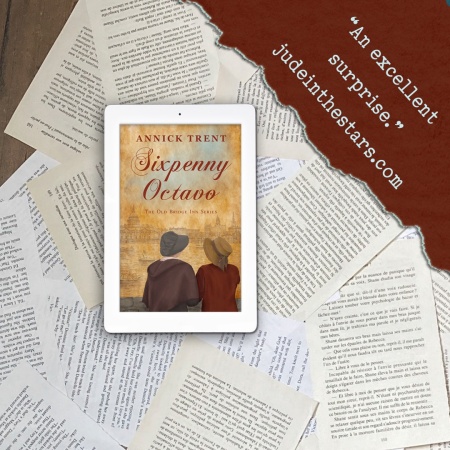 On a backdrop of book pages, an iPad with the cover of Sixpenny Octavo by Annick Trent. In the top right corner of the image, a strip of torn paper with a quote: "An excellent surprise." and a URL: judeinthestars.com.