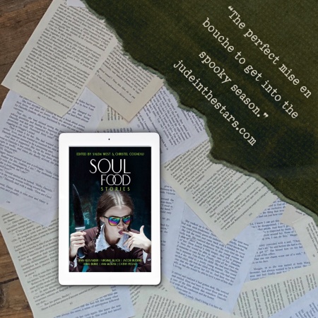 On a backdrop of book pages, an iPad with the cover of Soul Food Stories (anthology). In the top right corner of the image, a strip of torn paper with a quote: "The perfect mise en bouche to get into the spooky season." and a URL: judeinthestars.com.