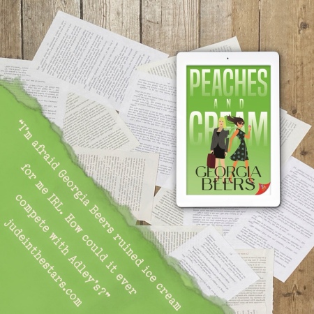 On a backdrop of book pages, an iPad with the cover of Peaches and Cream by Georgia Beers. In the bottom left corner of the image, a strip of torn paper with a quote: "I’m afraid Georgia Beers ruined ice cream for me IRL, how could it ever compete with Adley’s?" and a URL: judeinthestars.com.