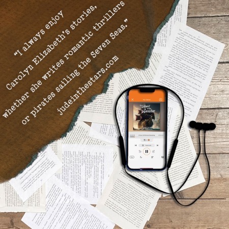 On a backdrop of book pages, an iPhone with the cover of The Heart of the Banshee by Carolyn Elizabeth, narrated by Chelsea Stephens. In the top left corner of the image, a strip of torn paper with a quote: "I always enjoy Carolyn Elizabeth's stories, whether she writes romantic thrillers or pirates sailing the Seven Seas." and a URL: judeinthestars.com.