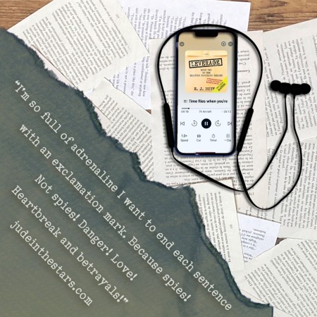 On a backdrop of book pages, an iPhone with the cover of Leverage (Halcyon Division #2) by E.J. Noyes, narrated by Abby Craden. In the bottom left corner of the image, a strip of torn paper with a quote: "I’m so full of adrenaline I want to end each sentence with an exclamation mark. Because spies! Not spies! Danger! Love! Heartbreak and betrayals!" and a URL: judeinthestars.com.