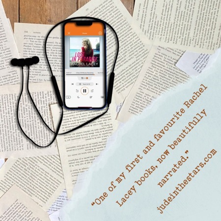 On a backdrop of book pages, an iPhone with the cover of Lost in Paradise by Rachel Lacey, narrated by Ellie Gossage. In the bottom right corner of the image, a strip of torn paper with a quote: "One of my favourite Rachel Lacey books, now beautifully narrated." and a URL: judeinthestars.com.